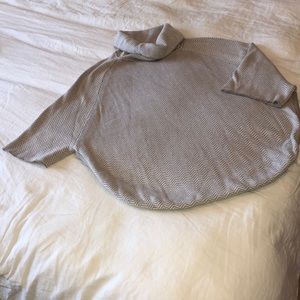 Loft turtleneck sweater with side slits.